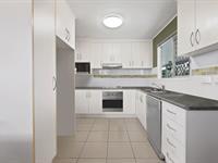30 Keelan Street EAST MACKAY QLD 4740 Just steps from the beach, this well presented highset home is packed with fantastic features, including a large deck, fully fenced backyard with dual side access for a future shed. Currently tenanted until 26th of July 2025, this one could certainly be appealing to the investor or owner occupiers need not worry as you can take possession of this home within the first 6 months of ownership. Only steps to Mackay's Far Beach and conveniently located just a 10 minute drive from the CBD, you'll enjoy easy access to all amenities while embracing a relaxed coastal lifestyle. On the upper level is where you'll find you'll spend most of your time offering a generous living area, three bedrooms and main bathroom. The main living area comprising the kitchen, dining and lounge spaces featuring polished timber floors is the perfect space for all to enjoy, the modern kitchen offering plenty of storage and ample bench space. Away from the living spaces you'll find the homes three bedrooms and main bathroom with separate toilet. All bedrooms with built-in-robes and not to forget this home is fully air conditioned for year round comfort. On the lower level you'll find a laundry, lockup garage, additional toilet, and an extra room with built-in-robe being the perfect space for additional guests or working from home, whatever you might need the space for. A handyman's dream, the home also features a dedicated workshop space and two covered carports in addition to the garage. The large back deck is perfect for entertaining family and friends, and there is side access to the expansive backyard. With 16 solar panels providing 3kW of energy, this home is energy efficient as well.