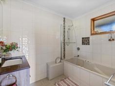 8 Old Waratah Rd Fish Creek VIC 3959 $885,000 Sitting proudly on approx. 1843m2 of land, capturing a rural feel with easy access to everything this popular township has to offer, this upsized property will appeal to anyone looking for space without sacrificing convenience. Inside is light and bright with a wide entertaining deck on two sides providing just the spot to sit and take in the views over the farmland at the rear and to the distant hills beyond the town. The open plan interior is zoned to provide a living room, dining room and lounge area - comfortable all year round with a wood heater plus ducted RC/AC. Centrally located, the stylish modern kitchen includes a huge breakfast bar, wall oven, gas hob, dishwasher, extensive storage including a butlers pantry and utility / storage area. There are five fitted bedrooms including a large master suite with walk in robe and spacious ensuite. Ducted reverse cycle heating and cooling to each of the bedrooms for year round comfort. Modern main family bathroom with spa bath, shower and separate w.c. A central roofed deck includes covered access to the downstairs garage / workshop / studio / games room and under-house storage. The rear garden is fenced and secure with access from Farrell Lane and includes an established vegetable garden. Keep your costs to a minimum with solar power (plus mains) and solar hot water (electric back up). Come and discover the delights of this quirky village with galleries, cafes, award winning Hotel, the Great Southern Rail Trail, community garden and primary school all on your doorstep, and only 15 minutes from the pristine coastline for swimming, surfing and hiking.