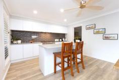 163 Waterside Drive Fletcher NSW 2287 $1,590,000-$1,700,000 A master residence of generous proportions throughout , well designed to suit the large north sloping 1721sqm block and take advantage of the natural bush outlook, summer breezes and winter sun. The street appeal is attractive and inviting with large feature front door and tastefully landscaped gardens, set amongst other high quality homes in a very respected, elevated location in Fletcher. Just 3 years old and family ready this property is all set to impress with the lifestyle on offer. The floorplan over 3 levels provides space for all occasions with several living areas, 4 spacious bedrooms, the master with heated floor ensuite and walk in robe, the main bathroom with heated floor is 3 way with large freestanding bath and a 3rd toilet on the lower level adds to the convenience. The kitchen has big gas cooker, butlers pantry and is open plan to the informal living area with large sliders to the supersized deck boasting drop down blinds, a relaxing spa, outdoor kitchen, loads of room for entertaining and adjoins the resort style pool with mineral water treatment and heat pump. Plantations shutters, ducted air, direct access to the double garage from entrance hall, loads of storage and combustion fire in the living provides many enjoyable aspects year round. Then venture further outside for more excitement, with decks on both rear levels taking full advantage of the peaceful bush views and enchanting birdlife, the backyard itself is expansive with terrace garden rooms, fire pit, vege patch, chicken coup, 3m x 3m garden shed and large greenspace and rear gate to miles of fire tail walking track. Solar power and 10,000 L water tank provides lean daily running costs and whilst in such a private and peaceful location enjoying walking distance to all the facilities of Fletcher shopping centres, parks and schools, just minutes from Freeway and Hunter Expressway with easy access to Newcastle, Central Coast and Sydney. The hard work is done here, just move in and enjoy.