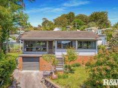 133 Brisbane Water Dr Point Clare NSW 2250 $860,000 - $920,000 By day take in the northeast aspect and enjoy stunning water views as well as the enchanting city skyline illuminated at night. This modernised home offers 3 spacious bedrooms, two living areas, two toilets and a functional yard. Conveniently located just moments away from medical facilities, lifestyle amenities, public transport, and schools, this property is ideal for first-time buyers, those looking to upsize or downsize, or investors seeking their next promising opportunity. Features to note: - Formal lounge overlooks the water and Gosford skyline. - Open plan kitchen, dining and second family space to the back of the home. - The bathroom features a shower, toilet, separate bathtub, along with a dual wall-mounted vanity complete with soft-close drawers and stylish black fixtures. - The kitchen is fitted with electric cook top and oven, rangehood, dishwasher, dual sink and soft close drawers and cupboards. - 3 Spacious bedrooms, 2 with water views and the master with bult In wardrobe. - Laminate flooring throughout. - Large, modernised laundry with a second toilet. - Single garage with ample storge space and automatic roller door. - Terraced style wrap around yards set on 461.6 sqm approx. Distances to note: - Point Clare Train Station, 850m approx - Point Clare primary school, 650m approx - Point Clare medical centre/chemist, 800m approx - Point Clare Aldi, 900m approx - Point Clare shopping precinct, 900m approx - Waterfront reserve and shared bike path, 300m approx - West Gosford shopping precinct, 1.8km approx - M1 Pacific Mwy, 6.5km approx