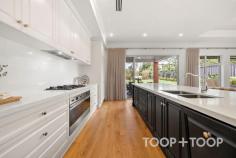 18 Myall Ave Kensington Gardens SA 5068 Custom designed and built to an exacting standard by Billy Diamantis of Kudos Constructions, this sensational residence is perfectly positioned in the peaceful tree-studded heart of one of the east’s most desirable and convenient dress-circle enclaves. An outstanding home with flexible living and entertaining options suitable for a range of discerning buyers, its beautifully designed floorplan offers space, versatility, security, and a sophisticated timeless aesthetic of understated luxury. The exceptional quality of construction is obvious from the outset. With a commanding street presence, the gracious frontage presents a modern take on classical Georgian architecture and proportion that incorporates a soaring portico entrance and remote entry double garage with secure internal access. A large and versatile reception room introduces stunning American oak floors, high ceilings and custom designed architraves. A wide gallery-like hallway stretches towards open plan living past a glass doored wine room, family laundry with north facing drying yard, and a glamorous powder room. The sumptuous master suite is conveniently located on the ground floor and includes a walk-in robe and designer bathroom with double vanities and walk-in shower. A glass slider bathes the bedroom with light and opens to a delightful internal paved courtyard. Upstairs accommodation is perfect for the family, with three bedrooms, all with built-in robes, a huge bathroom with bath, and another large living retreat. Expansive open plan living to the rear is the jewel in the crown, forming the ultimate light-filled space in which to entertain on a large scale or enjoy cosy nights in around the instant gas fire. The no expense spared gourmet kitchen incorporates extensive custom joinery, a range of fully integrated European appliances, and an engineered stone island bench around which to gather. Sliders expand indoor living through to alfresco living and the glorious rear garden. The dining pavilion is equipped with a built-in kitchen with Beefeater BBQ and rangehood, with a paved area providing an extended entertaining area. Gently elevated, a large lawn is edged by Japanese box and ornamental pears, which forms a private and tranquil haven teaming with birdlife The enviable family friendly lifestyle location of this property is very special. Surrounded by some of Adelaide’s leading schools, it’s a short stroll to magnificent recreational reserves, and close to Norwood Parade, Kensington Road, Leabrook, Erindale and Burnside shopping and restaurant precincts. This outstanding home is perfect for those seeking a peaceful and private property with all the prestige and convenience this highly coveted location has to offer. FEATURES YOU WILL LOVE • Custom designed & built in 2020 by Billy Diamantis & Kudos Constructions • Remote gate entry • Remote entry double garage with epoxy floor • Pedestrian gate intercom • Additional driveway parking • Ducted R/C air conditioning • Instant gas fire • Ceiling fans • 2 x Smeg ovens, gas cooktop & integrated dishwasher • Integrated Fisher & Paykel fridge/freezer • Butler’s pantry with room for second fridge • Outdoor kitchen with Beef Eater BBQ & rangehood • Wine room with racking & additional under stair storage • American Oak flooring • Extensive storage • Built-in robes • Alarm • NBN connected • Plantation shutters • Automated outdoor blinds • Automatic irrigation • Utility area LOCATION: Less than 8km to Victoria Square LIFESTYLE: Stroll to Kensington Oval and Kensington Gardens Reserve with ovals and tennis courts. Close to Norwood Parade, Kensington Road, Leabrook, Erindale and Burnside shopping and restaurant precincts SCHOOLS: Zoned to Magill Primary School and Norwood International. Walk to Pembroke. Close to St Peters Girls, Loreto, St Ignatius Junior School