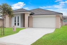 153 Scarborough Way Dunbogan NSW 2443 $949,000 Immerse yourself in serene beachside living with this captivating modern residence, a perfect sanctuary for those yearning for a coastal lifestyle without compromising on space and comfort. Envision a life where the gentle lapping of waves becomes a daily soundtrack, located a mere 800-metre stroll from the beach access track. Boasting a contemporary design, this less than 3-year-old abode sprawls across a 449 square metre plot, offering a generous 268 square metres of living space. The intuitively designed house unfolds over multiple areas, including a media room for cinematic escapades, a convivial family room, and a children's retreat for the little ones to frolic. The family chef will revel in the stylish kitchen, which features a contemporary 900mm electric oven and a gas cooktop, perfect for hosting and entertaining. The generous main bedroom, a true retreat, comes complete with an ensuite, ensuring privacy and luxury. Accommodating vehicles is a breeze with a spacious double garage. The low-maintenance land means weekends can be spent soaking up the sun and sea breeze rather than tending to the garden. Outside, a covered patio area beckons for alfresco dining or simply enjoying the temperate evenings. And with just 3km separating you from the bustling hub of Laurieton, all your amenities are within easy reach. This exquisite four-bedroom, two-bathroom home encapsulates the best of coastal living. Offering a life less ordinary, this is an opportunity to embrace the beachside dream with every modern convenience at your fingertips.