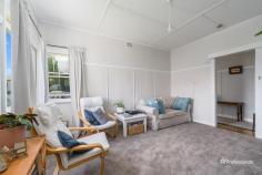 51 Taylor Street Armidale NSW 2350 $440,000 - $480,000 Welcome to 51 Taylor Street, a beautifully presented two-bedroom home in the desirable North Hill area. Perfectly positioned close to public schools and local corner stores, this home offers both charm and comfort in a sought-after location. Step inside to find two generously sized bedrooms, each featuring built-in wardrobes for ample storage. The warm and inviting living room boasts plush carpet, neutral tones, and abundant natural light, creating a cozy retreat for relaxation. The galley-style kitchen offers plenty of storage and flows seamlessly into the adjoining dining area, where polished floorboards and a charming wood fireplace set the scene for memorable family meals. The main bathroom is well-equipped with a shower, toilet, and vanity, while an additional toilet is conveniently located in the laundry. Outside, you’ll love the open and level backyard, complete with beautifully manicured garden beds. A double carport, single lock-up garage, and fully fenced front and backyard ensure security and practicality for any homeowner. Don’t miss this fantastic opportunity to secure a well-maintained home in an excellent location.