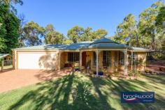 955 Gill St Mundaring WA 6073 $1,499,000 Set on a peaceful street near Mundaring townsite and local schools, this expansive property offers endless possibilities, including the potential to subdivide a 3-acre lot (subject to approvals). The 4-bedroom, 2-bathroom home is designed for family living, featuring three spacious living areas, fresh paint and well-sized bedrooms. Outdoors, the property shines with a huge alfresco entertaining space and an impressive American barn workshop. Subdivision potential for a 3-acre lot (subject to approvals) Close to schools and Mundaring townsite Spacious 4-bedroom, 2-bathroom home Three large living areas Freshly painted throughout Alfresco with TVs, speakers and blinds 144m² American barn workshop with mezzanine Two overhead cranes for heavy lifting and projects High-access roller doors for caravans or boats Neat, tidy and move-in ready Inside, the home provides an exceptional balance of space, functionality and style. With three living rooms, there’s no shortage of areas for the family to relax, entertain or work from home. The freshly painted interiors add a modern, clean feel and the generously sized bedrooms ensure every family member has their own space. The practical layout and neat presentation make it a comfortable and inviting family home that’s ready to move straight into. The alfresco space takes entertaining to the next level, designed with both functionality and style in mind. Wired TVs and integrated speakers ensure the perfect setup for hosting large gatherings or quiet movie nights, while the drop-down blinds create a cozy, intimate atmosphere when needed. This expansive outdoor area is ideal for year-round use, offering a seamless extension of the indoor living space and a true highlight for those who love to entertain. The large American-style barn workshop is a standout feature of the property, catering to a wide range of needs, from hobbyists to professionals. Equipped with two overhead cranes for heavy lifting, high-access roller doors perfect for accommodating boats or caravans, and a 32m² mezzanine for additional storage, this workshop is as practical as it is spacious. Air hoses and ample power outlets are located throughout, making it a fully functional workspace. A separate outdoor wash-down area with its own sump adds even more utility, ensuring this workshop is ready for any project or storage requirement.