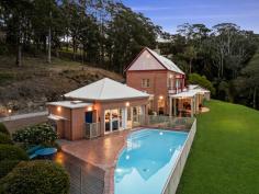 296 The Ridgeway Lisarow NSW 2250 $2,500,000 Spanning approx. 10.9 acres, this inspired estate embodies peace and privacy, welcoming you through a long driveway to one of the Coast’s most captivating homes. Designed by acclaimed architect Edward Alexander, this stunning residence seamlessly blends historical influences with contemporary luxury. Drawing inspiration from the esteemed English architect Edwin Lutyens, many of the home’s distinctive features—from the intricate square lattice windows to the corbelled brickwork—pay homage to Lutyens’ mastery of space and design. Spread across three levels, this masterfully crafted home offers expansive living spaces, including four generous bedrooms, two additional studies and/or bedrooms, and multiple living areas perfect for relaxation and entertainment. The master suite comes complete with a walk-in robe and ensuite, providing a private sanctuary within the home. The home’s artistic touches continue outdoors with a stunning architecturally designed swimming pool, complementing the curve of the landscape, and a charming alfresco entertaining area that opens to sweeping acreage vistas. The kitchen is a culinary haven, featuring stone benchtops, a combustion fireplace, and an effortless connection to the outdoor entertaining spaces. This property is also home to an original two-bedroom cottage (circa 1912), recently upgraded to offer fresh modern living and fully equipped with own parking, fenced yard, and fruit orchard. Showcasing a magnificent fusion of inspired architectural design, indulgent luxury, and beautiful natural scenery, this breathtaking estate is a rare treasure in today’s market. Features include: – Breathtaking 4.42 ha/10.9 acre block perfectly situated within a sought-after acreage region of the Central Coast; stunningly scenic and completely private whilst being within easy reach of every lifestyle convenience and attraction. – Statement main residence showcasing an inspired architectural design spread across three levels, drawing on acclaimed historical influences to create a truly unique multi-family oasis. – Panoramic views from each level, looking out across rolling green grounds to the tranquil rainforest and stunning mountains beyond. – Gourmet kitchen complete with gleaming stone countertops, gas cooking facilities, and an island breakfast bar, perfectly positioned to open out to the family meals area with a cosy combustion fireplace before spilling out to an undercover al fresco entertaining area. – Multiple formal and informal living and entertaining zones to choose from. – Master suite with own ensuite bathroom + walk-in robe. – Three additional, robed bedrooms – all taking in uniquely captivating views and serviced by a newly updated family bathroom following a clever three-way design. – Two separate, dedicated studies – ideal for twin work-from-home scenarios or optional extra bedrooms depending on your requirements. – Covered al fresco entertaining zone opening out to level green lawns – a superb space to relax and entertain in style. – Sparkling resort-style swimming pool taking in immersive acreage views. – Airy artists studio – a versatile space for creative projects or guest accommodation. – Oversized four-car garage + additional off-street parking for multiple vehicles. – All designed by local architect Edward Alexander, drawing on the work of renowned British architect Edwin Lutyens, and built by master builders Neville Bodycote and Chick Kerr. – Separately positioned, original two-bedroom cottage (circa 1912), beautifully upgraded to offer modern, self-contained living with a single lock-up garage and adjoining fenced yard + thriving fruit orchard. Extras include: NBN (fixed wireless), tank water, 6 x 20,000 litre water tanks (house) + 1 x 10,000 litre water tank (cottage), septic system. This unique coastal enclave has significant historical value and a multi-faceted past, which will be a delight to discover, while Lisarow itself continues to be a highly sought-after suburb. This prized address is well connected to a full suite of local amenities, including shops, cafes, and schools, while a 15-minute drive connects you to beaches, national parks, and buzzing lifestyle precincts. All just 45 minutes to Wahroonga for effortless access to Sydney and surrounds.