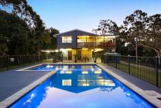 22 Friesian Court Tallebudgera QLD 4228 $2,000,000 This private paradise is an irresistible haven for those seeking a serene and spacious retreat. Occupying 1.75 peaceful acres, a landscape of towering trees and open greenery is accentuated by a meandering creek, with the delightful double-storey home positioned to bask in all this natural beauty. Set well back from the street in a prime, elevated perch, the owners have left no stone unturned here. Beautifully presented, gleaming timber floors flow throughout the top floor, complemented by a modern kitchen with servery window and an open plan living and dining area. This space seamlessly connects to an expansive wraparound deck, where you can savour views of the sprawling greenery and sun-soaked pool or entertain guests in style. Upstairs, three light-filled bedrooms feature, with the master suite boasting a spa ensuite. A brand new internal staircase links with the lower level, hosting two additional bedrooms and bathrooms, an office / potential third bedroom, kitchenette, and a living room – an enticing extra for those seeking a dual living opportunity. Outdoors, after you've explored the natural wonderland setting, refresh yourself in the supersized saltwater pool. Trimmed with a vast sun terrace, it's another idyllic place to retreat and relax. Additional features of the property include a second undercover entertaining area, 11kW solar system, and parking for seven vehicles via two double carports and triple bay shed. Despite being a secluded sanctuary, enjoy the convenience of being only minutes away from Tallebudgera State School and the iconic Man on the Bike pizzeria. And if you're a beach lover, Burleigh's famed sand and surf are just 12 minutes away. Experience the tranquillity and quality first-hand – arrange an inspection today! House Features: Delightful double-storey home in an elevated position, capturing idyllic, tree-lined views Steeped in serenity and set well back from the street Gleaming timber floors throughout plus a brand new internal staircase Modern, spacious kitchen with a servery window to the outdoor entertaining area Open plan living and dining area seamlessly connects with the wraparound deck Five generously sized bedrooms serviced by four renovated bathrooms (includes master suite with a spa ensuite) Dual living opportunity, with a downstairs kitchenette and living room alongside two of the bedrooms and bathrooms A ground floor office with the potential to be converted into a third bedroom by simply adding a door. Expansive wrap-around verandah with servery window and bar, overlooks the sprawling greenery and pool Stunning 13m x 7m (approx.) saltwater pool with new chlorinator, trimmed in a vast sun-terrace Wraparound undercover patio Double carport Updated with new LED lights, built-in robes (to bedrooms) split system air-conditioning units and fans Four camera security system 6 speaker music system Storeroom Property Features: Supremely peaceful and private 7086m2 block Landscape accentuated by a meandering creek, towering trees and open greenery 11.8m x 6m 3-bay shed 3.2m x 3.2m shed 11kW solar system Instant hot water - 4 gas bottles Solar sensor lights Abundant parking Two water tanks (irrigation only) Envirocycle Rooftop dish Location: Approx. 3 mins to Tallebudgera State School, local shops and eateries Approx. 5 mins to Coplick Family Sports Park Approx. 6 mins to St Andrews Lutheran College Approx. 12 mins to Burleigh Heads Approx. 14 mins to Palm Beach Approx. 16 mins to Currumbin Beach Approx. 21 mins to Gold Coast Airport Approx. 36 mins to Surfers Paradise Disclaimer: Whilst every effort has been made to
