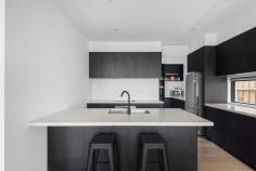 3/108 Fortescue Avenue Seaford VIC 3198 $985,000 - $1,083,500 A genuine work of contemporary art defined by its meticulous craftsmanship and flawless presentation, this near-new 3-bedroom townhome has been carefully crafted to create a sophisticated coastal lifestyle that surpasses all expectations, captivating with its flawless design and exquisite attention to detail. An architectural facade, engineered Oak floors and high square-set ceilings introduce a grand layout with light flourishing into every corner, centred around vibrant living and dining spaces with magnificent integration to its adjacent deck and yard. Refined materiality persists inward, with stone counters over a designer ebony kitchen, where supporting Bosch elements and a walk-through pantry emphasise its enhanced refinement. Dual walls of stacker doors frame private gardens to the rear while extending life to the northeastern deck, welcoming the morning sun with a pergola overhead. The ground floor's main bedroom with a designer ensuite and a fitted walk-in robe provides options for living at all ages, with two additional bedrooms on the upper floor around a vast second lounge and family bathroom. A prudent modern insertion in a quiet coastal pocket echoes the broadening vogue of its location, moments from Kananook Tennis Club and Reserve, Kananook Creek walking trails, Kananook Station, buses, and the beautiful foreshore, with Seaford Village, freeway access, Kananook Primary and Frankston CBD all within a brief drive. Additional features include split-system air conditioning, LED downlights, premium blinds, a full-sized laundry and lower-level powder room, and a double garage.
