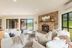 370 Spring Grove Rd Spring Grove NSW 2470 $1,825,000 Rarely does a property of this caliber and grandeur grace the market. Perfectly nestled in a private, picturesque setting, this exquisite home offers an unparalleled blend of sophistication, style, and serenity. Positioned within the prestigious enclave of Spring Grove, it boasts breathtaking rural vistas and exceptional privacy—an address you won’t soon forget. Every inch of this residence is a testament to superior craftsmanship and luxury, from the newly installed premium flooring to the brand-new chef’s kitchen, designed with both functionality and elegance in mind. Featuring dual butler’s pantries, a freestanding 900mm Smeg gas cooker, and expansive stone benchtops, the kitchen seamlessly flows into the dining area and opens directly to the formal entertaining space—often referred to as the "ballroom" for its grandeur. A well-appointed bar enhances the adjacent lounge, making entertaining effortless. Key Features: Luxurious Master Suite – Awash with natural light and uninterrupted rural views, the master retreat features French doors leading to the veranda, a spacious walk-in robe, and an opulent ensuite complete with a double vanity and corner bath. Guest & Additional Bedrooms – Upstairs bedrooms enjoy spectacular views and balcony access, while a private downstairs guest suite offers its own veranda entrance, walk-in robe, and ensuite. Grand Foyer & Living Spaces – A sweeping staircase with an elegant timber balustrade sets the tone for the home’s refined aesthetic. The open-plan design enhances natural light flow, while the home office provides a quiet, functional workspace. Showstopping Lounge & Entertaining Areas – The main lounge centers around an exposed brick fireplace, complemented by large sliding doors, an abundance of natural light, and a fully equipped bar area complete with sink, cabinetry, and fridge space. Exquisite Bathrooms – All three bathrooms have been meticulously upgraded with high-end 2-pac vanities, stone benchtops, sleek tapware, and sophisticated lighting. The master ensuite and main bathroom include indulgent bathtubs, while the guest bathroom offers dual access from the living area. Functional & Stylish Laundry – The galley-style laundry boasts ample storage, an expansive benchtop, and direct access to the double lock-up garage. Upstairs, a spacious walk-in linen cupboard adds even more practicality. This striking two-story brick residence exudes timeless appeal, with its gabled and bullnose roofs, expansive balconies, and large windows that capture the surrounding natural beauty. Set on 3.25 hectares (approx.), the property offers an elevated position at the end of a long driveway, ensuring peace and seclusion. Whether you envision an equestrian retreat, a private sanctuary, or an entertainer’s paradise, the possibilities are endless. This exceptional home invites you to craft the lifestyle of your dreams—combining the best of traditional architecture with modern country elegance.