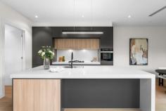 1/18 Broughton Road Surrey Hills VIC 3127 $2,000,000-$2,200,000 Welcome to 1/18 Broughton Road, a beautifully designed townhouse that perfectly blends modern architecture with urban living. This exquisite property offers a luxurious lifestyle with its spacious interiors, stylish finishes, and an unbeatable location in the heart of Surrey Hills. Property Features: - Bedrooms: 4 generously sized bedrooms, each designed with comfort and style in mind. The master suite features an elegant chandelier and ample natural light, creating a serene retreat. - Bathrooms: 3 modern bathrooms equipped with high-end fixtures, ensuring a spa-like experience at home. Enjoy the convenience and luxury of well-appointed spaces for relaxation. - Garage: Double garage spaces provide secure parking and additional storage, a rare find in urban settings. - Living Spaces: The open-plan living and dining area is perfect for entertaining, featuring stunning flooring and an inviting ambiance. The living room, adorned with tasteful decor and a cozy coffee table, flows seamlessly into the dining area, making it ideal for gatherings with family and friends. - Kitchen: The gourmet kitchen boasts modern appliances, ample counter space, and stylish cabinetry, making it a chef's dream. Prepare meals while enjoying views of the beautifully landscaped lawn through large windows. - Outdoor Area: Step outside to your private porch and lush grass area, perfect for alfresco dining or enjoying a morning coffee surrounded by nature. - Interior Design: Every corner of this home is thoughtfully designed, from the foyer that welcomes you with warmth to the carefully selected furniture and decor that enhance the overall aesthetic. -Neighborhood: Located in a vibrant community, this townhouse is just moments away from local cafes, parks, and shopping, offering the perfect blend of convenience and tranquility. Enjoy the best of urban living while being surrounded by beautiful greenery.
