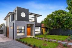 1/18 Broughton Road Surrey Hills VIC 3127 $2,000,000-$2,200,000 Welcome to 1/18 Broughton Road, a beautifully designed townhouse that perfectly blends modern architecture with urban living. This exquisite property offers a luxurious lifestyle with its spacious interiors, stylish finishes, and an unbeatable location in the heart of Surrey Hills. Property Features: - Bedrooms: 4 generously sized bedrooms, each designed with comfort and style in mind. The master suite features an elegant chandelier and ample natural light, creating a serene retreat. - Bathrooms: 3 modern bathrooms equipped with high-end fixtures, ensuring a spa-like experience at home. Enjoy the convenience and luxury of well-appointed spaces for relaxation. - Garage: Double garage spaces provide secure parking and additional storage, a rare find in urban settings. - Living Spaces: The open-plan living and dining area is perfect for entertaining, featuring stunning flooring and an inviting ambiance. The living room, adorned with tasteful decor and a cozy coffee table, flows seamlessly into the dining area, making it ideal for gatherings with family and friends. - Kitchen: The gourmet kitchen boasts modern appliances, ample counter space, and stylish cabinetry, making it a chef's dream. Prepare meals while enjoying views of the beautifully landscaped lawn through large windows. - Outdoor Area: Step outside to your private porch and lush grass area, perfect for alfresco dining or enjoying a morning coffee surrounded by nature. - Interior Design: Every corner of this home is thoughtfully designed, from the foyer that welcomes you with warmth to the carefully selected furniture and decor that enhance the overall aesthetic. -Neighborhood: Located in a vibrant community, this townhouse is just moments away from local cafes, parks, and shopping, offering the perfect blend of convenience and tranquility. Enjoy the best of urban living while being surrounded by beautiful greenery.