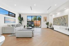 3/4 Medway Street Box Hill North VIC 3129 $1,600,000-$1,700,000 This brand-new dual-level townhouse is a meticulously designed, contemporary offering in one of Box Hill North's most sought-after locations. Just minutes from Box Hill Central's vibrant retail, dining and entertainment precinct, the home is also within walking distance of parks, childcare centres and local employment zones. Zoned for Kerrimuir Primary School and Box Hill High School, it's also perfectly positioned near public transport options. Designed with modern industrial inspiration, the home's striking facade combines textured brickwork with smooth render, creating a bold sophisticated aesthetic. The statement entryway, featuring a recessed porch and oversized timber door, offers a grand yet understated welcome. The black panel-lift garage door integrates into the design. Stunning 2.7m square-set ceilings enhance the sense of space, while opulent herringbone timber flooring flows throughout. The open-plan design is filled with natural light and large black-trimmed glass sliding doors open to a private courtyard. A centrally controlled zoned heating and cooling system ensures year-round comfort, while modern LED downlights illuminate. The ground-floor guest bedroom is a retreat, complete with a study and private ensuite. An external storage shed adds practicality. The decadent kitchen blends industrial chic with refined luxury. A four-seater breakfast island with 60mm marble-look stone, waterfall edging and feature v-panel backboards sits beneath striking black pendant lights. The splashback matches the stone benchtops while a matte-black double bowl sink with a gooseneck flick mixer is sophisticated. Finger-pull gloss white cabinetry and drawers provide storage, while quality 600mm appliances, including a gas burner cooktop, oven and dishwasher, cater to the needs of modern living. A spacious butler's pantry extends the kitchen's functionality, offering additional stone countertops, an extra sink and a second stove. Upstairs, three oversized bedrooms branch off a sunlit retreat, each with generous robe storage and ensuites. The bathrooms are luxurious, featuring floor-to-ceiling wall tiles, vanities with 60mm marble-look stone, avant-garde sink and tapware and fully frameless showers with dual shower heads and niche shelving. The main bedroom's ensuite adds an indulgent freestanding bathtub. Property Highlights: • Brand-new townhouse with high-end finishes • High ceilings, herringbone timber flooring and zoned AC • 60mm stone, quality appliances,butler's pantry
