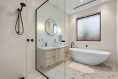 1/18 Broughton Road Surrey Hills VIC 3127 $2,000,000-$2,200,000 Welcome to 1/18 Broughton Road, a beautifully designed townhouse that perfectly blends modern architecture with urban living. This exquisite property offers a luxurious lifestyle with its spacious interiors, stylish finishes, and an unbeatable location in the heart of Surrey Hills. Property Features: - Bedrooms: 4 generously sized bedrooms, each designed with comfort and style in mind. The master suite features an elegant chandelier and ample natural light, creating a serene retreat. - Bathrooms: 3 modern bathrooms equipped with high-end fixtures, ensuring a spa-like experience at home. Enjoy the convenience and luxury of well-appointed spaces for relaxation. - Garage: Double garage spaces provide secure parking and additional storage, a rare find in urban settings. - Living Spaces: The open-plan living and dining area is perfect for entertaining, featuring stunning flooring and an inviting ambiance. The living room, adorned with tasteful decor and a cozy coffee table, flows seamlessly into the dining area, making it ideal for gatherings with family and friends. - Kitchen: The gourmet kitchen boasts modern appliances, ample counter space, and stylish cabinetry, making it a chef's dream. Prepare meals while enjoying views of the beautifully landscaped lawn through large windows. - Outdoor Area: Step outside to your private porch and lush grass area, perfect for alfresco dining or enjoying a morning coffee surrounded by nature. - Interior Design: Every corner of this home is thoughtfully designed, from the foyer that welcomes you with warmth to the carefully selected furniture and decor that enhance the overall aesthetic. -Neighborhood: Located in a vibrant community, this townhouse is just moments away from local cafes, parks, and shopping, offering the perfect blend of convenience and tranquility. Enjoy the best of urban living while being surrounded by beautiful greenery.