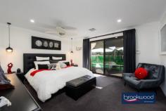 3 Owl Ln Gidgegannup WA 6083 $2,000,000 Perched atop a gentle rise on two hectares, this distinguished residence effortlessly fuses contemporary comfort and country living. The property boasts exceptional amenities and commands serene views across the undulating landscape to a tree-lined dam in the lower corner, creating a picturesque backdrop for daily life. 4 bedrooms 3 bathrooms 2012-built brick and iron Large lock up 2 car garage Extensive bitumen parking area Library office media room Poolside Cabana under main roof Large Alfresco & Entertaining Deck Below ground Solar heated pool 5.2Kw Solar system with 18 panels Plumbed powered man cave/granny flat 10 x 20 3 Phase Powered workshop w 2x hoists Heated spray booth with filtered extraction fan Bore, retic, 3-ph generator 2 hectares, 2 gated entrances Close to Mundaring & Midland shopping precincts Double doors reveal a sophisticated entry hall, where premium porcelain tiles extend across the thoughtfully conceived floor plan. The immediate impression is of space and light; the home’s exemplary attention to detail is evident from the first step inside to be welcomed by the multi-room music system throughout the home. To one side of the entry, a sophisticated media room demonstrates the home’s commitment to modern living. Fully wired for sound and featuring a statement bay window, this versatile space, with its plush carpeting, serves equally well for casual movie nights or more formal gatherings. An expansive open-plan living zone at the heart of the home creates a natural gathering point for family life. The contemporary kitchen is a study in modern elegance, with striking black Essa stone benchtops contrasting beautifully with slim black hardware on the abundant under-bench storage. A 900mm oven and induction cooktop cater to the serious cook, while the white two-door dishwasher maintains the kitchen’s crisp aesthetic. A dedicated coffee bar and walk-in pantry ensure the main workspace remains uncluttered and primed for culinary creativity. The central meals area flows naturally to a spacious family room, where direct access to the large Alfresco area leading to the sheltered below-ground salt pool that creates a seamless connection between indoor and outdoor living. This thoughtful layout epitomises modern Australian living, where every element has been carefully considered to deliver an easy, elegant lifestyle. The thoughtfully arranged accommodation wing extends from the family room via a central hallway. A delightful library with bespoke storage solutions creates a sophisticated retreat with the added luxury of direct pool access. Adjacent, a dedicated home office provides a focused environment for work or study, embodying the home’s commitment to balancing family life with professional needs. The main bedroom suite exemplifies sophisticated living, with sliding doors seamlessly connecting to the pool area. This generous parents’ retreat encompasses a king-sized bedroom finished with quality carpeting, sheers & blockout curtains, a walk-in wardrobe, and a refined ensuite, where fluted glass shower screens, double basins and a separate WC add elements of luxury and privacy. Junior bedrooms demonstrate equal attention to detail, each appointed with mirror-fronted built-in robes and a combination of Roman and Venetian blinds. These rooms are serviced by a bright family bathroom featuring a shower and tub, complemented by a practical arrangement where the separate WC is positioned within the walk-through laundry at the hall’s end. The outdoor living spaces have been curated to create a resort-style environment for year-round enjoyment. The centrepiece is a solar-heated salt pool protected by a shade sails and surrounded by sophisticated entertaining zones. These include a deck with an integrated teppanyaki bar and an air-conditioned cabana with bathroom facilities. Outdoor roll up awnings provide additional climate control, ensuring comfortable use of these spaces regardless of weather conditions. This thoughtful integration of indoor and outdoor spaces, combined with practical amenities and luxurious touches, creates a home where every aspect of modern family life has been carefully considered and catered for. Exemplary residential amenities set a high standard, and the workshop complex and grounds maintain this commitment to excellence, with an array of features elevating this estate beyond the ordinary. The crowning achievement is a magnificent 20m x 10m workshop, designed with 6.5m clearance and comprehensive 3-phase power. Two vehicle hoists and a dedicated spray booth create a premium workspace. This exceptional facility offers limitless potential for both passionate enthusiasts and professionals. A sophisticated ‘man cave’ has been created within the workshop complex which could be easily converted to a granny flat. This retreat has climate control, a complete kitchen, and bathroom facilities. A separate entry opens to a wrap-around verandah, perfect for relaxing after a day of projects. The auxiliary structures continue with a single carport and a powered 6m x 9m garage, complemented by two 40-foot sea containers thoughtfully converted and powered for machinery storage. Together, these create a comprehensive compound for vehicles and equipment. The 2-hectare grounds showcase intelligent planning. Extensive paving surrounds the home, and two substantial rainwater tanks (250,000 and 24,000 litres), a high-yield bore, and a winter dam ensure water security. Carefully placed outbuildings and statuary enhance the landscape, creating visual interest throughout the property. Every aspect of security and convenience has been considered: dual entry points with electric gates, comprehensive reticulation systems, a rooftop fire suppression system, monitored security alarm, CCTV and Intercom systems. 3 phase generator backup and extensive landscape lighting all contribute to a secure, low-maintenance environment. Solar powered hot water system and 5.2kw with 18 solar panels. Zoned reverse cycle air conditioning throughout the primary residence provides the final touch to what is truly a turn-key property. This remarkable Hills residence presents a rare opportunity to acquire a premium lifestyle property where every detail has been meticulously planned and executed, creating an environment where luxury and practicality coexist perfectly.