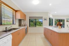 59 Sunbird Drive Woree QLD 4868 $769,000 Therese Plath is delighted to present this exceptional home, offering ultimate privacy with no rear neighbours and stunning, uninterrupted views of the treed backdrop, all set on a generous 923m² block. Perfectly situated with no through traffic located in one of Cairns' premier suburbs, this property is conveniently close to St Mary's Secondary School, St Gerard Majella Primary School, day care centres, and just 8.3km from the Cairns City Centre. The immaculate residence features an open-plan, tiled layout including spacious living, dining, and kitchen areas. The well-appointed kitchen boasts ample cabinetry, perfect for creating culinary masterpieces. The living spaces flow seamlessly outdoors, offering a great place to relax and enjoy the natural surroundings and magic backdrop of the picturesque mountains. With four bedrooms in total, three are generously sized with built-in wardrobes and air conditioning, while the master suite includes an en-suite with a single vanity, shower, and toilet. The remaining three bedrooms share a large main bathroom featuring a single vanity, shower, and a bath. Additional features include: Fully air-conditioned Tiled living areas Carpeted bedrooms Internal laundry with ample storage Double lock-up garage with internal access