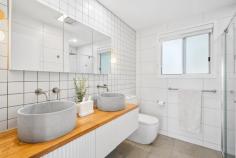 14 Elizabeth St Wyoming NSW 2250 Instant street appeal, beautifully renovated interiors, a lush leafy outlook, and dream al fresco entertaining spaces – this captivating property has it all! Perfectly positioned in a tranquil, tree-lined street within one of Wyoming’s most sought-after neighbourhoods, it’s a fantastic opportunity for families looking to settle in or investors seeking a move-in-ready home with strong rental appeal. Light-filled and stylish, this home has been thoughtfully updated to enhance comfort and functionality. A modern kitchen and stunning bathroom blend contemporary finishes with practical design, while the expansive wraparound deck and fully fenced backyard provide the ultimate setting for kids, pets, and entertaining. Features include: – Three bedrooms, all with ceiling fans; two with large built-in robes. – Stunning family bathroom featuring floor-to-ceiling tiles, a rain head shower, a floating double vanity, and a second WC. – Spacious living areas, including a lounge room with an office nook, plus an open-plan kitchen and dining flowing out to the deck. – Entertainer’s dream deck, offering ample space for outdoor dining and lounging, overlooking the private backyard. – Modern kitchen with an abundance of soft-close cabinetry, a corner pantry, Euromaid appliances (dishwasher, oven, and electric cooktop), a built-in breakfast bar, and a window splashback overlooking the backyard. – Two split-system air conditioning units in the living areas and ceiling fans in all bedrooms for year-round comfort. – Fully fenced backyard, tiered with level grassy areas – perfect for kids and pets. – Established gardens with lush greenery, including tibouchina, hibiscus, lilly pilly, camellia, citrus, and more. – Oversized single lock-up garage. There’s so much to love about this incredible home! Plus, this coveted location offers easy access to all the conveniences of Wyoming (local schools, shops and public transport), Gosford (CBD, waterfront, hospital, and train station), and the lifestyle benefits of the Central Coast, including a selection of beautiful beaches. For those needing to commute, the M1 is within easy reach for travel to Sydney or Newcastle.
