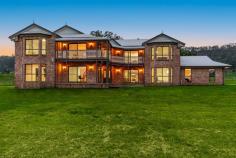 370 Spring Grove Rd Spring Grove NSW 2470 $1,825,000 Rarely does a property of this caliber and grandeur grace the market. Perfectly nestled in a private, picturesque setting, this exquisite home offers an unparalleled blend of sophistication, style, and serenity. Positioned within the prestigious enclave of Spring Grove, it boasts breathtaking rural vistas and exceptional privacy—an address you won’t soon forget. Every inch of this residence is a testament to superior craftsmanship and luxury, from the newly installed premium flooring to the brand-new chef’s kitchen, designed with both functionality and elegance in mind. Featuring dual butler’s pantries, a freestanding 900mm Smeg gas cooker, and expansive stone benchtops, the kitchen seamlessly flows into the dining area and opens directly to the formal entertaining space—often referred to as the "ballroom" for its grandeur. A well-appointed bar enhances the adjacent lounge, making entertaining effortless. Key Features: Luxurious Master Suite – Awash with natural light and uninterrupted rural views, the master retreat features French doors leading to the veranda, a spacious walk-in robe, and an opulent ensuite complete with a double vanity and corner bath. Guest & Additional Bedrooms – Upstairs bedrooms enjoy spectacular views and balcony access, while a private downstairs guest suite offers its own veranda entrance, walk-in robe, and ensuite. Grand Foyer & Living Spaces – A sweeping staircase with an elegant timber balustrade sets the tone for the home’s refined aesthetic. The open-plan design enhances natural light flow, while the home office provides a quiet, functional workspace. Showstopping Lounge & Entertaining Areas – The main lounge centers around an exposed brick fireplace, complemented by large sliding doors, an abundance of natural light, and a fully equipped bar area complete with sink, cabinetry, and fridge space. Exquisite Bathrooms – All three bathrooms have been meticulously upgraded with high-end 2-pac vanities, stone benchtops, sleek tapware, and sophisticated lighting. The master ensuite and main bathroom include indulgent bathtubs, while the guest bathroom offers dual access from the living area. Functional & Stylish Laundry – The galley-style laundry boasts ample storage, an expansive benchtop, and direct access to the double lock-up garage. Upstairs, a spacious walk-in linen cupboard adds even more practicality. This striking two-story brick residence exudes timeless appeal, with its gabled and bullnose roofs, expansive balconies, and large windows that capture the surrounding natural beauty. Set on 3.25 hectares (approx.), the property offers an elevated position at the end of a long driveway, ensuring peace and seclusion. Whether you envision an equestrian retreat, a private sanctuary, or an entertainer’s paradise, the possibilities are endless. This exceptional home invites you to craft the lifestyle of your dreams—combining the best of traditional architecture with modern country elegance.
