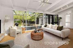 43 St Anns Pl Parkside SA 5063 Privately set amidst the leafy streets of Parkside and located on the city fringe close to the open greenspaces of the parklands, this freestanding return verandah symmetrical character home is a timeless blend of elegance and functionality. Set on a generous 602sqm allotment with front and rear lane access, this charming residence offers a harmonious modern living layout with the convenience of inner-city location, just 2 km's from the centre of the CBD. From the moment you arrive, beyond the privacy of the brush fence, you're greeted by the established garden and patio entrance that opens to the light and bright central hall, detailed with decorative ceilings and lovingly preserved polished floorboards. Immediately the warmth and character of three expansive bedrooms, adorned with impressive fireplaces, invite you in, each room echoing tales of comfort and history. The main bedroom, with WIR and ensuite access to the Bathroom, is large enough to be utilised as a second living room depending on your needs. The heart of the home reveals a contemporary open plan kitchen and living area, where every family gathering or entertaining experience is framed by stunning views of the established rear garden through the floor to ceiling rear windows. The skillion extension is lit by the North facing hi-light windows, where you can enjoy breakfasts from the island bench or dinners with friends in the integrated dining room with bay window. An underground cellar provides valuable storage space and the laundry with second toilet completes the modern extension of the traditional character cottage. Outside the property continues to deliver with outdoor entertaining deck ideal for Sunday BBQ’s, stepping out to the lawn and vegetable garden. Rear lane access from both the newly constructed two car garage, that provides ample storage and currently doubles as a home gym, and access from the original rear gate to the property ensures you are never short of secure parking and retain access to landscape as you desire. This Parkside abode offers outstanding value, delicately balancing classic elegance with contemporary features. Whether you're captivated by its historic charm or the allure of city fringe living, this home promises a lifestyle that's both enriching and convenient. Opportunities like this are rare, don’t miss your chance to own a jewel of Parkside. What we love about 43 St Anns Place Parkside - - Free-standing character residence on over 600sqm - Expansive open plan kitchen/living with tranquil backyard views - Three generous bedrooms, each with ornate fireplaces - Elegant decorative ceilings and immaculate polished floorboards - Newly installed Morse combustion heating for year-round comfort - Cellar accessed via kitchen for storage or wine enthusiasts - Renovated, modern bathroom combining style and comfort - New two-car garage to compliment carport and off-street parking - Exceptional dual street access from St. Anns Place and Stamford Lane - Located just minutes away from Hutt Street Cafes, the CBD and parklands - Zoned for Glenunga International High School and Parkside Primary School.