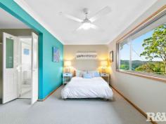 94 Ryans Rd Umina Beach NSW 2257 $970,000 - $1,050,000 Nestled on a quiet street with an amazing bush backdrop, this high-set 3 bedroom family home offers beautiful district views, and complete privacy. While feeling secluded, the property is situated within easy access to primary and secondary schools, Everglades Country Club, shopping centres and the golden sands of Umina and Ettalong beaches, with Woy Woy railway station just a 4.1km drive, commuting to work is a breeze. The home boasts a light-filled and spacious open-plan living-dining area with cathedral ceilings, skylights, and generous windows. The updated country-style kitchen surprises with real timber benchtops and modern appliances. 3 bedrooms look out onto forest and mountain views, all with built-in robes, and the large main with a walk-through robe and ensuite. The surprises continue outside with front and back decks providing ample space to entertain your guests in a spectacular bush setting. There are low-maintenance landscaped gardens (with a mature lime-tree), and plenty of off-street parking for up to 3 vehicles. Other features of this property include - - Air-conditioning - Elevated 834.7 Sqm block - Timber entertaining deck - Main bathroom with bath & oversize shower - Separate laundry room