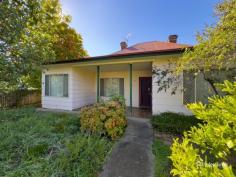 145 Markham Street Armidale NSW 2350 $400,000 - $440,000 Nestled in the heart of Armidale, 145 Markham Street offers the perfect blend of character, space, and convenience. This charming weatherboard home features three generously sized bedrooms and is ideally positioned within easy walking distance to the CBD, schools, shops, and parks. The home’s layout includes a well-appointed main bathroom complete with shower-over-bath, vanity, and toilet, plus a second toilet located in the laundry for added convenience. Two enclosed sunrooms provide flexible spaces ideal for children’s playrooms, home offices, or extra storage. A living room with a wood fireplace creates a warm and inviting atmosphere, while the kitchen offers ample bench space and an adjoining room that could easily be transformed into a butler’s pantry or breakfast nook. Step outside to discover a spacious, fully fenced yard dotted with established trees—perfect for kids, pets, or simply relaxing in the fresh air. A single garage completes the package. Whether you’re a first home buyer, growing family, or savvy investor, this centrally located gem presents endless potential in a sought-after position.