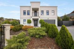 8 Chandler Grove Greenwith SA 5125 $1,600,000 - $1,700,000 A shining example of upsized living, this magnificent four-bedroom residence sits on a 2015 sqm landholding with landscaped zones, natural walking trails and mature trees creating a botanic garden vibe. The palatial 406sqm floorplan basks in tranquil views across rolling hills and gullies, and features four separate living zones, four generous bedrooms and two decadent bathrooms. A perfect fusion of modern luxury elements and grand space creates a dream living experience for families while suggesting fun and freedom can come with a side of finesse. From the airy comfort of the open-style leisurely lounge to the fabulous games room and oversized open plan living with a spectacular kitchen to host grand-scale parties, this home caters to your every whim. The carpeted master bedroom makes itself at home on the ground level, basking in beautiful views across the alfresco and terrace to the natural landscape beyond. It boasts a ravishing ensuite of grand proportions and luxurious appointments... think bidet, bathtub and more. The upper level features the fourth living area - a central-point rumpus room where three more bedrooms and another decadent bathroom converge. Alongside the alfresco is a landscaped terrace where you bask in the autumn sun and enjoy those glorious gully views, as well as a lawn area and firepit zone for wintry outdoor evenings with marshmallows and mates. Highlights: - C.2020 substantial family home with gully views on repeat - 406sqm floorplan on a 2015sqm block - Spacious open-concept lounge, open plan family living area, games room, rumpus - Premium skylit kitchen: waterfall-finished stone island bench, pantry, dishwasher - Carpeted ground floor primary suite with a walk-in robe, ensuite, ceiling fan - Fully tiled ensuite featuring a bathtub, double wall-hung vanity, bidet, double frameless shower - Three generous bedrooms with ceiling fans upstairs - Large, fully tiled family bathroom: bath and shower - Ground floor powder room - Modern laundry - Downlights and feature lighting - 2x Ducted reverse cycle air conditioning - Double glazed windows - Solar Panels - Tiled double garage with internal entry and storage area - Side-gate parking area for trailer, boat or van - Short drive to Highland Village Shopping Centre and bus stops A rare find, this home will blow you away. For more information contact Jakub Ratajczak on 0448 114 454.