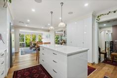 16 Nardoo Crescent O'Connor ACT 2602 $2,100,000 This beautiful home was designed and built by Canberra local Gina Carmody and features 198sqm of living plus is situated in a premier street in the heights of O'Connor. With a green leafy outlook from the large floor to ceiling windows and doors, the home is streaming of natural light. A lovely renovation and extension has been undertaken in 2024. The two storey home has a flexible floorplan; upstairs there are three bedrooms, one bathroom, large open plan kitchen dining and living area which flows to the alfresco terrace with excellent views. Downstairs there is a large two bedroom self-contained area, perfect for a teenagers retreat, home office space or to rent out. Located so close to excellent schools, shops, O'Connor Ridge, CSIRO and Universities, this is wonderful opportunity to secure a large quality home in such a fantastic location so close to lifestyle amenities. - wooden flooring ( Blackbutt) to the upstairs lounge, kitchen, dining, hallway, bedroom/ office - new blinds to dining with privacy screen and complete sunblock - new blinds to upstairs lounge, bedrooms and downstairs bedroom - renovated kitchen - added pantry with drawers and cupboards/fridge cavity, door handles to kitchen cabinets/ drawers - solar panels - reverse cycle air conditioning (zoned) - added laundry/powder room upstairs - landscaping at the front with hedge, retaining wall and pathway - wooden decking/floor to the front portico - replaced entire sewerage pipes (from old terracotta to new PVC) - upstairs bathroom - newly designed and fully renovated with tiling from floor to ceiling / electric mirror with light/electric Japanese toilet with heated seat/ vanity/ heated towel rail/ new shower & bath - added linen cupboards and storage cupboards downstairs to the kitchenette area - replaced staircase with blackbutt and replaced flooring to downstairs kitchenette area and hallway - renovated bathroom downstairs- added electric mirror cupboard and vanity - renovated outside tiled floors with French tiles - added new decking with balustrade - added ambiance lighting to the decking - added pizza oven and outdoor cabinetry/glass sink with premium quality taps with hot n cold water - new paint throughout - additional external laundry located downstairs - double garage plus ample visitor parking