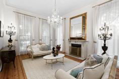 7 Victoria Ave Canterbury VIC 3126 Australia $6,500,000 - $7,100,000 A rare example of 1890 Victorian Italianate architecture in Canterbury’s Golden Mile district, this enchanting residence blends century-old embellishments with modern luxuries. Designed by John Beswicke, whose works include the Hawthorn Town Hall, the stately façade guides guests into another world where 12-foot (approx.) ceilings and Baltic floors wrap a display of marble cast-iron fireplaces, intricate cornices, and ornate ceiling roses. At the front of the home, the lounge room is a refined setting for fireside entertaining beneath a sparkling chandelier, and the dining room hosts majestic feasts beside a bay window. An elegant library provides a wall of bookshelves for the avid reader or home-based work, while upstairs, a home theatre is fully equipped for a cinematic experience. The back of the home offers a modern open plan layout that pampers daily relaxation and meals, connecting with the backyard for indoor-outdoor entertaining. At its heart, a gourmet kitchen provides a host of premium fixtures including a wide Falcon stove, a V-Zug combi-steam oven, a Shaws sink, and gleaming granite benches. A sandstone patio indulges sheltered alfresco dining and sun-drenched enjoyment, enriched by a low maintenance garden for kids to play amid an array of delicious apple trees. Centred around a sparkling swimming pool and spa, the home promotes hours of fun for all, complemented by an indoor bathroom and sauna. The accommodation places guests in a private bedroom downstairs, while the family is coddled upstairs with three additional robed bedrooms and two bathrooms, including an ensuite and dressing room to the main bedroom. Finished with a lush treetop balcony, a large basement cellar, and a remote-controlled double garage, the home is cocooned in luxuries including ducted heating and cooling, ducted vacuum, and a security alarm. Situated among Melbourne’s most prestigious public and private schools, the home is within an easy stroll of Maling Road’s quaint village shopping, Canterbury station, and Canterbury Gardens, while minutes from Camberwell Junction’s array of entertainment..