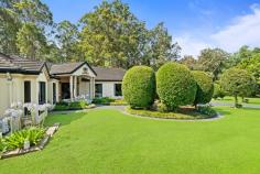 62 The Valley Way Mardi NSW 2259 Set on 2.5 acres (approx.) of lush, manicured grounds, this exceptional single-level residence delivers a rare fusion of elegance, seclusion, and modern comfort. Nestled in a private and picturesque setting, it offers a sanctuary of space, with stunning natural surrounds and a thoughtfully designed home tailored for effortless living and entertaining. Beyond the grand circular concrete driveway, a stately entryway welcomes you to a home of generous proportions, where multiple living areas flow seamlessly to resort-style outdoor spaces. The expansive kitchen, finished with black granite benchtops, forms the heart of the home, while the windows capture breathtaking garden views. Offering four spacious bedrooms, a dedicated study with external access, and a pool house with a bathroom and kitchenette, this residence caters perfectly to families, entertainers, and lifestyle seekers alike. Outdoors, the resort-style pool and spa are complemented by a covered alfresco area with an outdoor kitchen and pizza oven, creating an ideal setting for entertaining. The property also includes a pond, and ample storage options, making it a practical yet private haven, just minutes from Tuggerah Westfield, Tuggerah Railway Station, and the M1 motorway. Features include: – A grand and inviting single-level design with 9ft ceilings, curated for effortless living and entertaining. – Multiple light-filled living areas, including a formal lounge, rumpus room & family room. – Expansive kitchen featuring black granite benchtops, Bosch appliances, a four-burner induction cooktop, a pantry, and a breakfast bar. – Oversized master suite, complete with a walk-in robe and ensuite. – Three additional bedrooms, all with built-in robes + a dedicated study with external access, ideal for a work-from-home situation. – Three beautifully appointed bathrooms + conveniently separate WC, ideal for guests and everyday practicality. – Large laundry with external access, offering ample storage and functionality. – Pool house with bathroom and kitchenette. – Pool and heated spa, powered by 3-phase electricity for year-round comfort. – Covered alfresco area with outdoor kitchen, featuring a gas pizza oven, perfect for entertaining. – Manicured gardens, and a picturesque pond, creating a peaceful retreat. – Charcoal coloured concrete circular driveway with grand fountain feature, enhancing street presence and accessibility. – Three-car garage with internal access + separate gardening garage. – Caravan port and garden shed, providing additional storage and practicality. – Council rates: $3,000 (approx.) pa. Extras: 6.6kW solar system, Envirocycle system, x2 underground 22,500L concrete tanks (totalling 45,000L), provision for a wood log heater in the family room, 3 gas bayonets for heating, and ducted air conditioning throughout the home. This prestigious acreage offers an unparalleled lifestyle of space, privacy, and accessibility. While embracing the tranquillity of its natural surrounds, it remains just moments from Tuggerah Westfield, quality schools, and the M1, providing seamless access to Sydney and Newcastle.