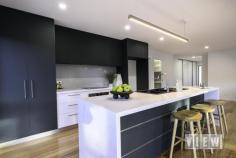 20 Madeline St Latrobe TAS 7307 $825,000 Are you looking for less maintenance but not ready to sacrifice space or style? This elegant, quality-built, brand new home is set on a low-maintenance 471m² block with its own title and offers a stylish living solution without the upkeep of a larger property. Elegant Design & Entry – On entering the property you are welcomed by an exposed aggregate driveway with a lock up garage and additional off-street parking to accommodate a second vehicle, caravan, or trailer. The homes front entrance has a sense of grandness, with its unique multi-direction stairway leading one direction to the sheltered timber-lined entry landing and another directly into the landscaped, fully fenced garden. Inside, a spacious entry boasts ample built-in storage on both sides creating a welcoming space without compromising roominess. Light-Filled Living with Scenic Views – Enjoy sunlit open-plan living spaces with views of Bells Parade parklands and glimpses of the Mersey River through the trees. Imagine enjoying the changing of the seasons with Autumn colours right from your windows! Primary Bedroom Suite – The expansive main bedroom, is a generous 4 x 5m and overlooks serene parkland views. It can comfortably accomodate a king size bed with enough room left for additional furniture. There’s even a convenient TV outlet installed for leisurely in-room TV viewing. Being located away from the rest of the sleeping quarters and with its own spacious walk-in robe and a stylish ensuite, this room offers ultimate privacy & peace. Additional Bedrooms/Bathroom Area – In a separate section of the home you’ll find two additional, well-sized bedrooms, a separate toilet, and a large bathroom featuring a floating vanity, walk-in shower, and a freestanding soaker tub, which is perfect for unwinding at the end of a long day. Functional & Stylish Laundry & Garage Space – The thoughtfully designed laundry room includes ample storage, a clever in-cupboard laundry hamper, and direct outdoor access. The extra height, single garage features a 10FT ceiling, ideal for large vehicles. Sleek Kitchen & Pantry – The kitchen impresses with elegant matte dark green custom cabinetry and waterfall-edge countertops. A plumbed-in fridge alcove, built-in air-fryer/oven, electric cooktop and a dishwasher offer a kitchen space that is functional yet easy to keep clean. A walk-in pantry located near by is equipped with ample shelving, power points, and countertop space, keeping the main kitchen clutter-free. Easy Access for Indoor-Outdoor Living – From the dining area, step directly out to an extra large entertaining area and fully fenced garden that wraps around the home. Low-maintenance garden beds and artificial turf make upkeep a breeze, leaving you more time to enjoy the scenic views and relax with a morning coffee or a glass of wine while watching the world go by. Extra Features Beautiful Tasmanian Oak floors flow through the hall, kitchen, and living areas, while the wet areas feature practical tiles and the bedrooms offer the cosiness of carpet. A Daikon Reverse Cycle Split System keeps the home cool in Summer and warm & cosy in Winter, while block-out roller blinds throughout also assist with climate control and offer privacy. Prime Location & Community Amenities – Situated close to local restaurants, scenic walking trails, and essential amenities like the local pharmacy and shops, this home truly lets you enjoy Latrobe living at its best. Move in, Relax, & Savour Life in Bells Parade in a Home Where Style Meets Convenience! Call Colin on 0408 666 301 to book your VIEWing.