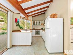 94 Ryans Rd Umina Beach NSW 2257 $970,000 - $1,050,000 Nestled on a quiet street with an amazing bush backdrop, this high-set 3 bedroom family home offers beautiful district views, and complete privacy. While feeling secluded, the property is situated within easy access to primary and secondary schools, Everglades Country Club, shopping centres and the golden sands of Umina and Ettalong beaches, with Woy Woy railway station just a 4.1km drive, commuting to work is a breeze. The home boasts a light-filled and spacious open-plan living-dining area with cathedral ceilings, skylights, and generous windows. The updated country-style kitchen surprises with real timber benchtops and modern appliances. 3 bedrooms look out onto forest and mountain views, all with built-in robes, and the large main with a walk-through robe and ensuite. The surprises continue outside with front and back decks providing ample space to entertain your guests in a spectacular bush setting. There are low-maintenance landscaped gardens (with a mature lime-tree), and plenty of off-street parking for up to 3 vehicles. Other features of this property include - - Air-conditioning - Elevated 834.7 Sqm block - Timber entertaining deck - Main bathroom with bath & oversize shower - Separate laundry room
