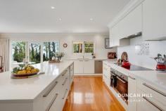 20-22 Duke St Mittagong NSW 2575 Welcome to Yarrabee, an extraordinary luxury residence that redefines the art of living well. Perched majestically atop Mount Gibraltar, this fully renovated haven offers an unparalleled executive lifestyle, harmoniously blending sophistication with the tranquillity of nature. As you step inside via a grand foyer with a vaulted ceiling, you’ll be captivated by the elegant, oversized living room with expansive views to the north. The four oversized bedrooms are all designed with comfort and elegance in mind. The master suite features a sumptuous ensuite and a large walk-in robe, promising a private retreat. At the opposite end of the house, a beautifully appointed one-bedroom apartment with a separate entry provides an ideal space for guests or a serene home office. At the heart of Yarrabee lies a large family room with a state of the art chef’s kitchen and grand butler’s pantry, seamlessly connected to a spacious laundry, making entertaining effortless and daily life a pleasure. You will be spoilt for choice when it comes to relaxing, either in the formal lounge, the spacious family room with gas fireplace, or in the cosy library/music room. Surrounded by nearly 3 acres of park-like garden, Yarrabee invites you to unwind in serene privacy. The breathtaking vistas stretch to Sydney, where you can catch a glimpse of the iconic Centrepoint Tower. And with the charming towns of Bowral and Mittagong just moments away, you can indulge in fine dining, boutique shopping, and vibrant community events while retreating to your serene sanctuary at the end of the day. Embrace a less ordinary life at Yarrabee, where luxury meets nature, and every moment is fresh air. Experience the extraordinary—your tranquil haven awaits. Features include; Gas fires in the family room and apartment Electric wall heaters in all living spaces and bedrooms Underfloor heating in all bathrooms 18-panel, 5 kW solar system Blackbutt timber floors Kitchen featuring two Miele ovens, Miele dishwasher, four cooker Miele induction cooktop, two burner ILVE gas cooktop, integrated range hood and stone bench tops Large laundry/mudroom with ample storage 5m x 4m garden shed Park-like garden that comes into its own during Spring and Autumn and includes majestic mature trees, Cherry Blossoms, and Camellias