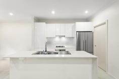 3/15 Bellambi Street Tarrawanna NSW 2518 $1,050,000 - $1,150,000 Perfectly positioned in the heart of Tarrawanna, this three-bedroom townhouse offers easy access to Corrimal Village, local schools, leafy parks and public transport. The open-plan living and dining area is tiled for practicality and flows seamlessly to a private, north-facing courtyard-ideal for quiet morning coffees or Friday night drinks under the stars. The modern kitchen is the heart of the home, fitted with stone benchtops, a gas cooktop and generous storage. Upstairs, three large bedrooms each feature built-in robes, with the primary suite featuring an ensuite and double sink. A dedicated study nook offers a quiet corner to focus, main bathroom with bathtub and extra powder room downstairs. Every detail has been carefully considered from ducted air-conditioning and secure internal access to a double garage, a water tank, and security screens for added peace of mind. Whether you're starting out, slowing down, or seeking a low-maintenance lifestyle with room to grow, this modern townhouse is ready to welcome you home. Modern townhouse, low-maintenance living Large primary suite complete with ensuite, double sink Three carpeted large bedrooms all with built-in-wardrobes Tiled living and dining area, private courtyard Double-garage with internal access, ducted a/c
