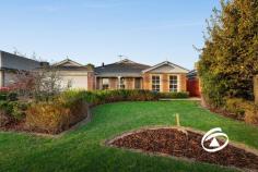 25 Kinsale View Berwick VIC 3806 $775,000 - $852,000 Exceptional Family Living Experience a home thoughtfully designed for family living, offering spacious, light-filled interiors and a seamless connection to the outdoors. From the warm and welcoming lounge with feature gas fireplace to the expansive open-plan living area, every room enjoys tranquil garden views. At the heart of the home lies a generous hostess kitchen, complete with ample bench space and extensive cabinetry—ideal for everyday use and entertaining alike. The property features four well-sized bedrooms with built-in robes, while the master suite includes a walk-in robe and a full ensuite. A family bathroom services the secondary bedrooms. Freshly painted in part and recently updated, the home is equipped with ducted heating and refrigerated cooling for year-round comfort. The sunlit courtyard integrates effortlessly with the main living areas, creating an inviting space for outdoor gatherings. Additional highlights include a double garage with rear roller door access and extra room for a trailer or additional vehicle. Nestled at the end of a quiet court, encompassed by a mature colour filled garden, close to schools, adjacent to a newly constructed wetland and the Hallam Valley walking trail, this home delivers space, comfort and convenience in a most private location.