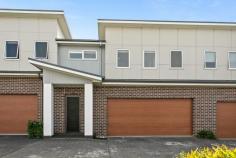 3/15 Bellambi Street Tarrawanna NSW 2518 $1,050,000 - $1,150,000 Perfectly positioned in the heart of Tarrawanna, this three-bedroom townhouse offers easy access to Corrimal Village, local schools, leafy parks and public transport. The open-plan living and dining area is tiled for practicality and flows seamlessly to a private, north-facing courtyard-ideal for quiet morning coffees or Friday night drinks under the stars. The modern kitchen is the heart of the home, fitted with stone benchtops, a gas cooktop and generous storage. Upstairs, three large bedrooms each feature built-in robes, with the primary suite featuring an ensuite and double sink. A dedicated study nook offers a quiet corner to focus, main bathroom with bathtub and extra powder room downstairs. Every detail has been carefully considered from ducted air-conditioning and secure internal access to a double garage, a water tank, and security screens for added peace of mind. Whether you're starting out, slowing down, or seeking a low-maintenance lifestyle with room to grow, this modern townhouse is ready to welcome you home. Modern townhouse, low-maintenance living Large primary suite complete with ensuite, double sink Three carpeted large bedrooms all with built-in-wardrobes Tiled living and dining area, private courtyard Double-garage with internal access, ducted a/c