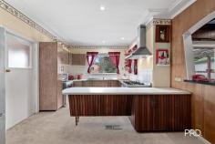 6 Valley Road Katoomba NSW 2780 $990,000 - $1,080,000 Retro Charm Meets Modern Convenience Step into this retro 1960s preserved & styled home on a 663sqm block in Katoomba. This split-level home features hardwood and brick veneer construction, preserving its original character with a vintage kitchen, six-burner stainless steel stove and an iconic 1960s pink and black bathroom. Inside, enjoy oak-panelled walls, elegant light fixtures, parquetry floors and a cozy wood heater. Outside, mature gardens surround a private paved courtyard, offering a peaceful Blue Mountains lifestyle. Key Features: • 4-bedroom, 1960s brick veneer home • Private courtyard and secluded backyard retreat • 10 minute walk to Katoomba station, cafes and amenities • Vintage pink and black bathroom • Internal laundry with chute and additional toilet • Spacious drive-through garage with internal access • Combustion wood heater • Premium six-burner gas stove • Substantial water tank Take advantage of this location with only ten minutes from Katoomba town centre, this home blends classic charm with modern convenience.
