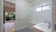 2 The Boulevard SOUTH MISSION QLD 4852 Set in the heart of Tropical North Queensland, just 800 metres from the stunning 14km Mission Beach coastal strip, this beautifully designed modern home offers the perfect balance of style, comfort, and convenience. Positioned on a prime corner allotment, this light-filled, open-plan residence is designed for effortless tropical living. Banks of louvers maximise airflow, while split-system air conditioning ensures year-round comfort. Cool, easy-care tiled floors flow throughout, enhancing the home's breezy, low-maintenance appeal. The modern kitchen features granite benchtops, a stainless-steel range hood, and a dishwasher, making meal prep a delight. Entertain or unwind on the wide side veranda, overlooking the lush, leafy surroundings. The main bedroom retreat includes a walk-in robe and private en-suite with shower, WC, and vanity. Two additional bedrooms enjoy two-way access to the main bathroom, which boasts a plunge bath, shower, separate WC, and vanity. Built-in wardrobes in all bedrooms provide ample storage. Step outside to your own tropical paradise, where an attractive swimming pool and pool deck are framed by vibrant, low-maintenance gardens-perfect for relaxing or entertaining. A spacious 8m x 6m carport with an integrated locker adds practicality, while minimal lawn upkeep ensures more time to enjoy the coastal lifestyle. Offering rural views and set in a leafy, private location, this home is a true retreat-just moments from the beach.
