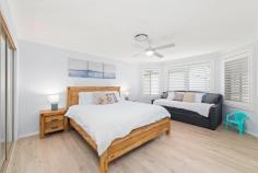 131 Bagnall Beach Road Corlette NSW 2315 Nestled in a family-friendly neighbourhood just a short approx. 650m stroll to the serene shores of Bagnall's Beach, this impeccably maintained residence offers a perfect blend of comfort, style, and practicality. A charming combination of brick and weatherboard construction is complemented by lush, manicured lawns, setting the tone for the inviting interiors that await within. Step inside to discover a bright and airy home, thoughtfully enhanced with white plantation shutters, ceiling fans, white-wash flooring, ducted air conditioning and solar electricity. Designed for effortless living and entertaining, the open-plan kitchen and living area provide a seamless flow-ideal for growing families or retirees seeking both functionality and style. The heart of the home features a sleek kitchen with stainless steel appliances, perfectly positioned to overlook the main living space and transition smoothly into the dining area. Featuring: - Four well-appointed bedrooms, each featuring ducted air conditioning and roller blinds for year-round comfort - Versatile Queenslander room with plantation shutters and paved flooring-perfect for relaxation or entertaining - Low-maintenance, fully fenced backyard with a paved outdoor entertaining area and an additional shed ideal parking for a boat or caravan - Secure double lock-up garage, plus side access, ideal parking for a boat and caravan Enjoy the best of coastal living with Bagnall's Beach just approximately a 650m walk away, while the stunning Dutchman's Beach is only a short 1.2km walk. Conveniently located within an approx. 3 minute drive to Salamander Bay Shopping Centre, this home offers a lifestyle of ease, comfort, and accessibility.