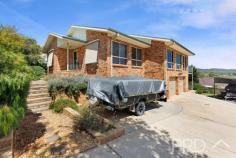 11 The Pavilion Tumut NSW 2720 $799,000 Perched high in an exclusive and quiet cul-de-sac, with elevated views of the picturesque town of Tumut and its surrounds. You will love the versatility and functionality of this well-appointed family home. Offering great diversity of living, both upstairs and down, 11 The Pavilion boasts four great sized bedrooms, multiple living rooms and rumpus area, study and a total of three bathrooms over the two levels. With additional timber decks on both levels and ample secure space for vehicles, boats or caravans. This is a central opportunity that is not to be missed. Call today to book your inspection! Premiere Features: - Four great sized bedrooms all with ducted reverse cycle air conditioning, master boasting walk in robe and ensuite - Main bathroom with separate bath and shower room and powder area positioned adjacent with separate toilet - Ensuite boasts shower, toilet and single vanity - Large centrally located entertainer's kitchen with electric cooktop, stainless appliances including dishwasher, ample cabinetry options and bench space, including display cabinetry and large island bench (boasting water, power and breakfast bar) - Free flowing open plan tiled living and dining area's directly off the kitchen, all designed to take in the picturesque surrounds and capitalise on its elevated positioning - Formal additional lounge room upstairs - Formal study upstairs with direct external deck access - Partially covered timber deck, perfect for outdoor entertaining or simply taking in the picturesque surrounds - Fourth bedroom with built-ins is located downstairs and currently used as a rumpus room - Formal rumpus with direct external access - Third bathroom positioned downstairs with shower, toilet and single vanity - Great sized laundry with external access to rear yard - Downstairs covered external entertaining - Double lockup garage with direct internal access and additional access to secure dry storage and subflooring - Secure lock up shedding with additional 2 side awnings, perfect for additional cars and or boats - Garden shedding - Ducted reverse cycle air conditioning throughout the upper level - Internal stairs - Approximate 1,016m² allotment with low maintenance manicured grounds - Walking distance to major local sporting and recreational facilities Do not miss your opportunity to secure this very versatile family home with an elevated aspect of the picturesque surrounds of Tumut.
