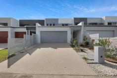 83 Superior Blvd Andergrove QLD 4740 Welcome to your dream lakefront lifestyle! This spacious and modern terrace home is all about comfort, convenience, and the uninterrupted water views of its lakefront positioning. Less than two years old and presenting like new, it offers all the benefits of a brand-new build without the wait or the hassle. Thoughtfully upgraded with features not typically included in standard builds, this home is move-in ready and packed with extras, plus there are no body corporate fees! Enjoy a low-maintenance lifestyle with the added bonus of being just minutes from local shops, schools, parks, and sporting facilities. Designed for relaxed, everyday living, the lower level features a bright and open plan layout that flows seamlessly from the living and dining area to the kitchen, opening straight onto the rear outdoor entertaining space. Neutral tones and stylish finishes like natural wood-look flooring and sleek cabinetry, create a calm, modern feel throughout. On the ground floor, you'll also find a convenient powder room, designated laundry, and internal access to the double garage. Storage is smartly integrated, including under-stair space and a storage cupboard at the rear of the garage. Upstairs, there's room to grow with four generous bedrooms, or three plus a media room or second living space, whatever suits your lifestyle best. The master suite features a walk-in robe and private ensuite, while the main bathroom includes a standalone bath and services the rest of the home. Additional comforts include a large linen cupboard, full air conditioning throughout for year round comfort, and clever storage options to keep everything organised. Love entertaining, this home makes it easy. The generous rear patio connects beautifully with the indoor living areas via stacking sliding doors, and a thoughtful kitchen servery makes outdoor dining a breeze. The backyard is beautifully landscaped to minimise maintenance, so you can forget about weekend mowing and there's even a lawn locker to keep your tools tidy. To top it all off, this home is powered by an efficient 6.6kW solar system, helping reduce your energy bills. Whether you're a growing family, a busy professional couple, or simply looking for a laid-back lifestyle with all the modern comforts, this home ticks every box. Stylish, low-maintenance, and in a prime lakefront location-what more could you ask for?