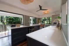 6 Jessie Lane SOUTH MISSION QLD 4852 Nestled in a lush, rainforest-like setting, this stunning three-bedroom, two-bathroom home offers a perfect blend of tranquility and modern comfort. Set on a large allotment, this cool, leafy sanctuary provides privacy and relaxation, making it an ideal escape from the everyday. Designed with a unique open-plan layout, the home boasts polished timber floors, plantation louvers for natural airflow, and a raised ceiling with a striking skylight feature. The spacious north-facing veranda is perfect for soaking up the tropical ambiance, while the rear undercover patio provides an ideal entertaining space. The new kitchen is a chef's dream, featuring a Caesar stone island bench, ample storage, and stylish finishes. Flowing seamlessly into the lounge and dining area, the space is both inviting and functional. The main bedroom retreat is a true highlight, complete with a luxurious ensuite featuring a plunge bath and vanity. Additional loft storage adds practicality to this thoughtfully designed home. Located just minutes from two boat ramps and surrounded by 12 stunning tropical islands in the Coral Sea, this home is perfect for those who love nature, adventure, and coastal living. Don't miss the opportunity to own this tropical hideaway-your private rainforest retreat awaits!