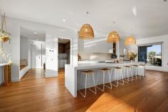 22 Hermitage Drive Moama NSW 2731 $1,685,000 to $1,795,000 This exquisite build is noticeably extravagant from the street and from the moment you walk through the front door. From the three metre high ceilings to the six metre long stone kitchen island bench, every little detail has been well thought out and presented exceptionally. As you walk through the front door you enter an impressive open plan kitchen, living and dining area. The kitchen is fully equipped with high quality Bosch appliances, an induction cooktop and a dishwasher. Additionally there is a butlers pantry for the storage of a fridge and appliances. The kitchen has a substantial amount of storage under the stunning six metre stone island bench and overhead cupboards. There is also a servery with a stone bench top and a bifold window perfect to enjoy an afternoon champagne or a morning coffee overlooking the pool and backyard. On the left hand wing of the home you will find three spacious bedrooms with built-in robes, block out blinds and ceiling fans. The elegant main bathroom has floor to ceiling tiles, a stone bath and stand-out high-class ABI brushed copper tapware. Following on down the hall is a separate powder room, a study area with a built in desk and a luxury laundry with extensive storage. In the opposite wing you will find the main suite and second living area or parents retreat. The main bedroom is overflowing with space and overlooks the inviting 8x4 magnesium solar heated pool through sliding doors. The master suite also has a generous sized walk-in-robe and ensuite with floor to ceiling tiles, custom built 6m timber vanity with ABI brushed copper tapware. Outside there is a huge outdoor area fitted with blinds, an outdoor kitchen with BBQ and a Jet Master fireplace perfect for the cooler nights. All lawns and gardens are low maintenance and are fitted with automatic sprinkler systems. There is an additional toilet outside with a vanity perfect for when entertaining or using the pool, avoiding the need for people to go inside. The garage has a double and single doors with 4 metre high clearance, perfect for the storage of a caravan and/or boat along with 4 additional car spaces. The home is kept comfortable throughout the year with commercial double glazed and louvre windows, evaporative cooling and ducted gas heating. Fitted with 8.2 kw solar panels to keep your energy bills at a minimum.