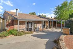 2 Joske Place Latham ACT 2615 $840,000 Tucked away in a quiet cul-de-sac, this meticulously maintained 4-bedroom home presents an ideal opportunity for a peaceful lifestyle. Just minutes from Latham Primary School, Kippax, and Belconnen Shopping Centres, you'll enjoy the convenience of local amenities right at your doorstep. Step into the warmth of your dream home, where comfort meets charm. Nestled in a quiet, welcoming neighborhood, this delightful property features a stunning fireplace that instantly becomes the heart of the home. Whether it's a chilly winter evening or just a moment of peaceful solitude, the gentle crackle of the fire invites you to unwind with a good book, a warm drink, or great company. The living room is thoughtfully designed with soft lighting and natural textures that enhance the fireplace's rustic elegance, creating a space that feels both timeless and lived-in. It's the perfect spot for gatherings, lazy Sundays, or simply enjoying the flicker of flames as the day winds down. Each of the four generously sized bedrooms is fitted with built-in robes for ample storage. The renovated kitchen, equipped with an electric oven, convection microwave oven and impressive pop up gas cooktop, makes meal preparation effortless. With ducted gas heating and evaporative cooling, you'll stay comfortable year-round. Families and pet owners will appreciate the generously sized laundry, complete with both internal and external access to the backyard for everyday ease. Step outside to the rear paved pergola, an inviting space for outdoor entertaining or relaxation. Dreaming of homegrown veggies, fresh herbs, and vibrant blooms, this fully established garden is ready for you to dig in and enjoy the harvest! Featuring multiple raised garden beds,and a thoughtfully planned layout, it's perfect for beginner and seasoned gardeners alike. Located in the ever-growing suburb of Latham, this home offers the convenience of being within walking distance to Latham Primary School and local shops, and just a short drive to Kippax Shopping Centre and Belconnen Town Centre. Living in such a sought-after location provides endless opportunities to enjoy all the amenities this family-friendly area has to offer. Features: 4 Spacious Bedrooms with Built-In Robes Open plan family & kitchen area Sunken Lounge room with feature fireplace Separate laundry room with external access Gas Cooktop Electric Oven Dishwasher Evaporative Cooling Ducted gas heating Recently renovated bathroom & separate toilet Outdoor workshop Additional rear storage shed Spacious enclosed rear yard with established gardens Covered Paved entertaining pergola Clothes line installed 2 Single Carports