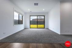 19 Namatjira Boulevard Huntly VIC 3551 $575,000 - $620,000 Boasting space, style and functionality, this contemporary four-bedroom residence presents an ideal opportunity for families or investors seeking a move-in ready home in a peaceful Huntly location. Positioned in a family-friendly neighbourhood and finished to a high standard, 19 Namatjira Boulevard is perfectly suited for modern living. The home welcomes you with a wide foyer entrance and a flexible floor plan designed to accommodate growing households. At the heart of the home is an expansive open-plan living and dining zone, complemented by a sleek kitchen featuring stainless steel appliances, a large island bench, walk-in pantry, and ample cabinetry. A second, separate sitting room offers additional space for formal lounging, a home theatre, or children's retreat. The master bedroom is positioned at the front of the home for privacy and features a generous walk-in robe and stylish ensuite. The remaining three bedrooms-each with built-in robes-are serviced by a central bathroom with bath, separate shower, and separate toilet, ideal for family convenience. Additional highlights include a spacious laundry with external access, ducted heating and cooling, double remote garage with internal entry, and low-maintenance front and rear yards ready for landscaping or play. Located just minutes from local schools, shops, Huntly Recreation Reserve and only 15 minutes from the Bendigo CBD, this quality-built home offers lifestyle, comfort, and long-term appeal. Key Features: • Four spacious bedrooms including master with ensuite and walk-in robe • Expansive open-plan living plus separate second lounge • Modern kitchen with 900mm oven, walk-in pantry and island bench • Double remote garage with internal access; ducted heating and cooling throughout