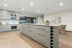 11 Gunian Boulevard Cable Beach WA 6726 $875,000 Big in size and even bigger on features, this huge family home really does have it all! Spread over a massive 752sqm corner block in popular Six Seasons Estate, the massive 4 bed, 3 bath home seamlessly blends space and style to deliver the modern, flexible living every family is searching for. Perfectly positioned opposite a park and just a short walk from the beach, it's a home and lifestyle package that's sure to appeal to a wide range of buyers. Fully fenced with secure gated entry, you'll never be short of parking with a huge shed with dual rollerdoor entry, a large double carport and plenty of secure driveway parking. Boasting a beautiful blend of space and style, the light and bright interior offers expansive open plan living and dining with a neutral colour palette and plenty of natural light thanks to louvre windows. At the heart of the home is the open kitchen complete with built-in pantry, feature tiled splashbacks, large fridge recess, overhead and underbench cupboards and long breakfast bar. Other key features include the large main bathroom, big separate laundry, ducted air-con, ceiling fans, modern downlights, window blinds and more! The bedroom layout sets this home apart with 4 big bedrooms, all with built-in robes and air-con, including 2 Master suites with walk-in robes and ensuites, adding another level of flexibility to this fantastic home. Designed to maximise Broome's famous outdoor lifestyle, doors from multiple rooms open onto the huge rear entertaining area, with ceiling fans, overlooking fully-shaded below-ground pool. There's plenty of lush green grass for the kids and pets to play and a huge additional storeroom that could easily be converted to another bedroom. Located close to local schools, parks, shops, and just a short walk over the dunes to the golden sands of Cable Beach, this amazing family home is sure to attract plenty of attention.