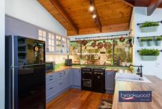 515 Marshwood Pl Sawyers Valley WA 6074 $1,000,000 Discover the ultimate retreat on a sprawling 4.94-acre property, where peace and tranquillity reign supreme—perfect for those seeking a serene escape from the hustle and bustle of everyday life. 4 beds, 2 bath plus office 1985 solid brick & iron Modern Kitchen/Laundry Raked timber ceilings Fresh tasteful decor R/C AC, open fireplace Below-ground pool Powered workshop Extensive R/water supply 4.94-acre bush block This stunning home features four spacious bedrooms, each equipped with built-in robes. The main bedroom boasts a luxurious en-suite and a generous walk-in robe, while a dedicated study with external access makes it an ideal space for your home business. Timber doors mark the threshold between the everyday and your private bush haven. Upon crossing this threshold, spotted gum floors extend a natural welcome while your gaze is drawn upward to raked timber-lined ceilings with exposed beams. This is a home that breathes with the rhythm of the surrounding bushland. Step down from the kitchen to find the north-facing meals area and family room, where a wall of glazing frames views of the natural landscape. Slide open the door to access the poolside entertaining zone that wraps around the rear of the home. This design transforms everyday meals into al fresco experiences, and hosting gatherings is a joy rather than a logistical challenge. The second bathroom is thoughtfully designed with both a shower and a bath, ensuring comfort for family and guests alike. Step outside to your very own paradise! Dive into the refreshing below-ground saltwater pool or cultivate your green thumb in the shade house and greenhouse, perfect for growing your own vegetables. Enjoy the bounty of nature with an array of fruit trees under cover in the shade house. Approximately 300,000 litres of rainwater capacity, monitored via a Smart Water system, demonstrate the property’s self-sustainable credentials, while reticulation to lawns, gardens and the shade house ensures that your green investment thrives even during your absence. For the handy individuals, this sale comes with an incredible assortment of tools and equipment that will ignite your creativity and productivity! Included in this fantastic package are: **Makita Cutoff Saw (Wood)** **Wia 250i Mig Welder** **Boc HF Tig Welder** **Oxy Acetylene Set** **Steel Bench with 6” Vise** **Small Metal Lathe** **Air Compressor** **Dewalt Thicknesser Planer** **Carbatec Thicknesser Planer** **Drill Press** **Bench Grinder** **Linisher** **Jet 14” Bandsaw** **Hafco 18” Bandsaw** **Hafco 250mm Table Saw** **Sherwood 8” Jointer** **Sherwood Router Table and Router (Cast)** **Sherwood Wood Lathe** **Sherwood 3hp Full Workshop Extraction Unit** ** Kubota tractor and ride on mower**