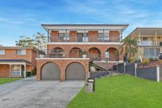 14 Small St Wyoming NSW 2250 Big on space, big on style, and beautifully upgraded inside and out – this is the ultimate family home for buyers seeking comfort, flexibility, and a move-in-ready lifestyle. Positioned in the tightly held ‘Valley View’ enclave of Wyoming, 14 Small Street captures breathtaking mountain and district views from its elevated setting while offering a spacious multi-level floor plan and standout entertaining spaces both inside and out. Lovingly renovated and further enhanced by its current owners, this impressive home pairs timeless design with a sleek modern finish and thoughtful lifestyle additions – including a fully landscaped backyard, extended outdoor entertaining zone, solar power, and a powered shipping container ideal for extra storage or a creative retreat. Features include: – Quality-built residence with striking street appeal in the prized ‘Valley View’ precinct. – Stylish interiors spread across two expansive levels, featuring warm timber tones, floating floors, a modern neutral palette, and contemporary finishes — including sleek plantation shutters. – Generous 683sqm block with dual-level lawns, beautifully landscaped gardens, and convenient side access. – Sleek open-plan kitchen with abundant bench and storage space, recently updated with quality new appliances and perfectly positioned to overlook the backyard and outdoor entertaining zone. – Multiple living and entertaining areas, including a spacious main lounge, separate dining, and tranquil upper-level retreat. – Four bedrooms upstairs (including a king-sized master suite with a walk-in robe, ensuite, and access to a shared balcony), plus a self-contained guest suite with ensuite on the entry level, perfect for teens, guests, or extended family. – Covered entertaining area extended with a pergola, creating the perfect space for relaxed gatherings and alfresco dining. – Tiered backyard with two grassy play zones – ideal for kids and pets. – 9.68kW solar panel system (22 panels, owned outright) with feedback to the grid. – Ducted air conditioning upstairs + split systems on the lower level for year-round comfort – Two-car garage with electric doors and internal access + gated off-street parking for an additional two vehicles. – Powered shipping container providing extra storage or potential conversion to a creative space or indoor-outdoor room (relocatable if needed). Positioned within walking distance of Valley View Public School (550m) and just minutes to local shops, transport, Gosford CBD, and the M1 for easy access to Sydney or Newcastle. Erina Fair, waterfront reserves, bushwalks, and beaches are all nearby, completing the ideal lifestyle package.