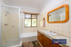 230 Naranga Pl Stoneville WA 6081 $1,100,000 Secluded at the end of a quiet Cul-de-Sac, this Hills homestead with wrap-around verandahs comes with all the extras essential to a well-rounded rural lifestyle. Sheltered outdoor living and entertaining space, a below-ground pool, a large workshop with 3-phase power, various outbuildings and gardens planted with productive fruit trees paint a picture of an idyllic Perth Hills lifestyle. 4 bedrooms 2 bathrooms 1980s-built brick and iron Country-style eat-in kitchen Formal lounge with SC fire South-facing alfresco ent Huge powered workshop B-ground swimming pool Ducted evap 6 kW solar 4.6 acres parkland cleared Top of private Cul-de-Sac A classic Australian design delivers relaxed comfort and practical style in a home with expansive outdoor living space and the extras essential to a well-rounded Hills lifestyle. An iconic wrap-around verandah leading to multiple entry points – including a formal lounge and a spacious eat-in kitchen—offers flexibility and a sense of generosity that immediately sets this property apart. The kitchen is the true heart of the home, featuring exposed brick and pine finishes and a warm, inviting atmosphere. This unmistakable sense of ‘home’ continues in the formal lounge, where a slow-combustion fireplace offers a focal point and the promise of cosy nights during the cooler months. A home office arranged off the lounge provides a secluded space for uninterrupted work and study. The principal bedroom, with a built-in robe and ensuite, sits at one end of the plan. The junior bedrooms – each with a ceiling fan and built-in robe – share the family bathroom, which is fitted with a tub, shower, and vanity. A sizeable south-facing verandah and gable-covered patio extend the living space, creating an extraordinary indoor-outdoor flow that celebrates every season. Whether basking in the soft winter sunlight or enjoying nature’s symphony on a summer night, this home offers an unparalleled living experience. Alfresco entertaining rises to new heights with pool and garden views, creating the impression of a private retreat. Arranged at one end of the patio is a spacious, lined and powered storeroom and a two-car carport. When the time for relaxing is over, this exceptional property has got you covered with a massive 9 m x 18 m 3-phase workshop with a machine shelter of the same size, an insulated sea container and various smaller outbuildings providing ample space for work, storage and creativity. The potential to keep a pony, multiple rainwater tanks, productive fruit trees – among them citrus, apple, apricot, and fig –and a 6 kW solar array add to an authentic Hills lifestyle. This secluded, family-friendly neighbourhood is only a few minutes from Mundaring, where you will find shopping, services, schools, parks, cafes and transport. The real beauty of this property is found in the tranquil natural surroundings, the freedom of abundant space and the scope to create a life in a classic Perth Hills setting.