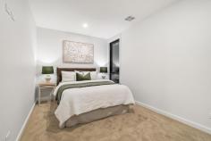 44 Robin Boyd Crescent TAYLOR ACT 2913 $1,100,000 Surrounded by nature reserves and nestled in the growing suburb of Taylor, this sophisticated 'as new' home has a lot to offer a large family. Its functional, modern design ensures low maintenance living, and its proximity to schools, shops and Canberra CBD, means less time commuting and more time relaxing. Built for comfort, style and functionality, neutral tones, timber look floors and thoughtful modern lighting provide a warming ambiance throughout this home. There is an open plan living and dining room and central executive style kitchen, which features stunning marble glass splash back, stone bench, exquisite fittings, sleek cabinetry, stainless steel oven, induction cooktop, and a walk-in butler's pantry. All season entertaining is invited in the formal lounge with an elegant electric gas fireplace and a covered outdoor alfresco terrace with servery, sink and barbecue. Also on the lower level is a third guest bathroom, fourth bedroom with robe, and laundry with external access. Upstairs, there are two more generous sized bedrooms with robes, a stylish family bathroom with separate shower, edgeless tub and WC, and an additional sitting room perfect for a children's retreat, studying or reading nook. The master suite is a haven offering built in cabinetry with a stone bench, walk-in robe, private balcony and luxurious ensuite complete with large shower, twin sinks, LED lighted mirrors and heated towel rack. Functional features of the home include air-conditioning, ducted heating, ample storage, security system, easy care fenced yard and two car garage with internal access. Taylor offers relaxed weekends perfect for family living. Explore nearby nature reserves, get active at Taylors adventure playground, discover local bike tracks or simply chill at home in one of the many spacious living zones. Conveniently located, this home is minutes to local schools, Amaroo Village Shopping Centre, Gungahlin town centre and Casey Market Town, and there is plenty of public transport on the doorstep including light rail to the CBD. Taylor is a growing suburb with several developments in the works including a government high school, two sporting fields and additional shops. Be quick to view this incredible family home in a family friendly community. Features - 'As new' modern family home in convenient location Bright open plan kitchen, living and dining room Executive style kitchen and walk in butler's pantry Formal lounge with contemporary electric fireplace Alfresco entertaining area with sink and servery Three robed bedrooms and stylish family bathroom Master suite with luxurious ensuite and walk in robe Balcony from master suite and upstairs sitting room Additional downstairs bathroom and large laundry Air-conditioning, ducted heating and ample storage Fully fenced, easy care backyard in quiet leafy street Two car garage with internal access, security system Close to local schools, shops, parks, nature reserves Minutes to Gungahlin town centre, 25 minutes to CBD