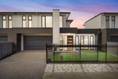 21 Chambers Ave Richmond SA 5033 $1,195,000 - $1,295,000 With four bedrooms and three bathrooms spread over two spacious levels, this sophisticated brand new build combines luxury with lifestyle at every turn. From electric sliding gates and intercom with keyless entry to its complete Smart Home System, everything can be scheduled or controlled remotely with just the push of a button. From a wide hallway entry, a front bedroom presents a wonderful option for guests, or a highly sought ground floor master with built-in robes and gorgeous floor length windows welcoming abundant natural light; a most luxurious bathroom with full-height tiling, floating vanity and frameless shower guaranteed to wash away daily stressors in an instant. Overlooking a fabulous open living and dining space, the kitchen of your dreams is home to SMEG stainless steel appliances including dishwasher, 900mm oven and 5-burner gas cooktop, infinite storage, a superb island with breakfast bar and pendant lighting and an invaluable butler's pantry with direct access to the garage. Sliding doors open onto an alfresco entertaining space under the protection of the main roof, overlooking a secure low maintenance courtyard with lawn strip. Automatic sensor lights will guide you upstairs, where three additional bedrooms add plenty of flexibility to sleeping arrangements, including a supersized master with stunning treetop views, huge walk-in robe and elegant ensuite bathroom with dual basin vanity and frameless shower; bedrooms three and four serviced by an equally impressive central bathroom with the addition of a deep freestanding bath. All the essentials: - Mirrored robes to bedrooms 3 & 4 - Separate laundry with alfresco access - Daikin Ducted reverse cycle air conditioning - Under stair storage - Double garage with internal + rear access - Secure gated front yard - Upstairs study nook - Torrens titled In a wonderful city fringe location just 5kms from the CBD and a little further to the sea, a world of convenience awaits on your doorstep.