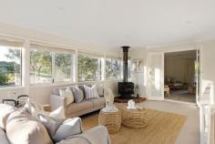 24 Fenton Crescent Frankston South VIC 3199 $1,150,000 - $1,265,000 Embrace the serene charm of Frankston South in this enchanting four-bedroom home, where lush native outlooks meet the soothing melodies of native birdsong. Nestled on a generous 1,482sqm (approx.) beachside block, its gentle sloping surroundings marry with Sweetwater Creek just behind. A distinctive living experience awaits in this thoughtfully crafted dual-level design, where treetop views take centre stage. The circular layout beautifully merges formal and informal living and dining spaces around a practical kitchen, creating a harmonious family environment. Enriched by the cosy crackle of two fireplaces, the atmosphere radiates warmth and character, while a rear bank of windows bathes the secondary living area in the soft glow of winter sun. Four spacious bedrooms and two light-filled bathrooms cascade across the layout, each reflecting their own unique personality, while all offering tranquil outlooks and adequate storage. Solid timber floors and large windows throughout celebrate the home's charm, while added features continue with a dedicated laundry with external access, an Actron Air cooling system, gas ducted heating, solar power with a Tesla battery, and rain water tanks. A circular driveway with rear double garage frames the established gardens and sun-drenched patio, while an enclosed veggie garden and rear chicken coop offer sustainable living options. Positioned within the Frankston High School Zone, with easy walking distance to Frankston Beach and public transport, with Frankston Hospital, Beauty Park, and Bayside Shopping Centre just moments from home.