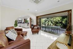 11 Tinonee Ct East Mackay QLD 4740 Timeless Brick Home with Modern Comforts and Entertaining Flair Blending striking street presence, thoughtful design and exceptional scale, this grand double-storey brick residence presents a rare opportunity to secure a home of substance and elegance. Set on a commanding 900m² allotment in a quiet, tree-lined cul de sac, this is a property where thoughtful design, modern updates and timeless character come together to create something truly special. Spanning approximately 292m² under roof, the home's generous proportions immediately set it apart. Originally constructed in 1980 and beautifully modernised since, it retains its original strength and character while embracing a layout that prioritises connection, functionality and lifestyle. Downstairs, multiple living areas, a dedicated home office and a seamless transition to the outdoor entertaining zone provide the perfect balance between relaxed family living and elegant hosting. At the heart of the home is a well-appointed kitchen featuring stone benchtops, a full butler's pantry, integrated storage, an electric cooktop and a sleek appliance hideaway that keeps surfaces clean and uncluttered. A wide servery window connects the kitchen directly to the covered alfresco area, enhancing its entertaining credentials. The nearby living space is climate-controlled with cassette air conditioning and the full-length timber stacker doors open to reveal an expansive outdoor area laid with natural stone, creating a flawless indoor-outdoor flow. Framed by established gardens and overlooking a sparkling inground pool, the entire rear of the home is designed to draw the outside in - perfect for the tropical climate and year-round enjoyment. Upstairs, warm polished timber floors set the tone for a peaceful retreat. A secondary lounge space provides a cosy spot to read or unwind, while all three bedrooms are generously proportioned. The master suite is particularly impressive, offering a split system air conditioner, a grand walk-through robe with his and hers storage and a stunning ensuite complete with dual showerheads and coastal-inspired glass vanities. The two additional bedrooms include built-in robes and box air conditioners. The main bathroom is both spacious and stylish, featuring a full-size bath and separate shower. Other notable inclusions throughout the home include a built-in bar cleverly tucked under the staircase, a large internal laundry with outdoor access, a double garage with remote entry, ample linen and under-stair storage and wide timber side gates for secure access to the backyard. The home is fully fenced and immaculately maintained, offering a sense of privacy and pride that's immediately felt from the moment you arrive. Combining enduring quality, generous scale and a homely warmth, 11 Tinonee Court is the kind of property that rarely comes to market - a true standout in both location and lifestyle. This is a residence designed for living, entertaining and enjoying every season of family life in one of Mackay's most desirable suburbs.